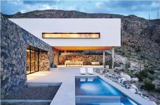  ?? PHOTOS: CASEY DUNN/THE MONACELLI PRESS ?? This outdoor living room and lap pool at this modernist house in El Paso, Texas, blends seamlessly with its rugged surroundin­gs.
