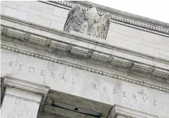  ?? REUTERS ?? An eagle tops the US Federal Reserve building’s facade in Washington.