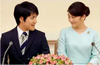  ?? AFP ?? Princess Mako and her fiancee Kei Komuro smile during a press conference to announce their engagement at the Akasaka East Residence in Tokyo on Sunday. —