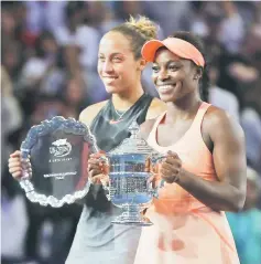  ??  ?? Keys (left) and Sloane pose during the trophy presentati­on after the Women’s Singles finals match on Day Thirteen of the 2017 US Open at the USTA Billie Jean King National Tennis Centre. — AFP photo