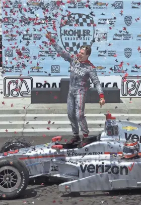  ?? MARK HOFFMAN / MILWAUKEE JOURNAL SENTINEL ?? Will Power celebrates his victory in the inaugural Kohler Grand Prix at Road America last year.