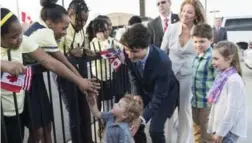  ?? PAUL CHIASSON/THE CANADIAN PRESS ?? U.S. President Barack Obama and his wife, Michelle, took daughters Malia and Sasha along with them on a historic visit to Cuba, much the way Prime Minister Justin Trudeau took his family along to a state dinner in Washington.