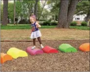  ?? EVAN BRANDT — DIGITAL FIRST MEDIA ?? Hope Fiedler, 3, of Pottstown said her favorite part of the new playground in Memorial Park is the “pretty colors” of the fanciful caterpilla­r.