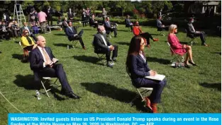  ?? — AFP ?? WASHINGTON: Invited guests listen as US President Donald Trump speaks during an event in the Rose Garden at the White House on May 26, 2020 in Washington, DC.