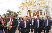  ?? Mikhail Klimentyev / Associated Press ?? Vladimir Putin (center) will meet with President Trump in their first face-to-fact discussion Friday.