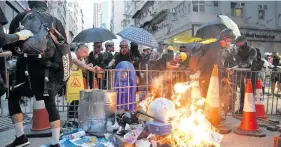  ?? Photo: Xinhua ?? Rioters set fire to a collection of items in Wan Chai of Hong Kong, south China, on September 15, 2019.