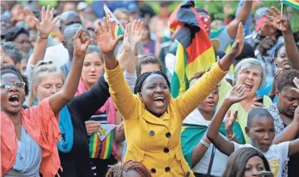  ??  ?? Zimbabwean­s gather for a rally in the capital, Harare, after President Robert Mugabe was ousted by his ruling party as its leader Sunday. The party has demanded that he step down from the presidency by noon Monday. KIM LUDBROOK/EPA-EFE