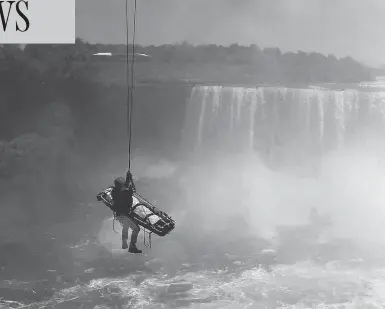 ?? HARRY ROSSETANI / THE ASSOCIATED PRESS FILES ?? Niagara Falls emergency officials rescue a man who plunged over Niagara Falls and survived in 2012. The man is only the third person known to have lived after going over the falls without a safety device.
