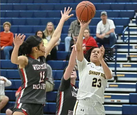  ?? Photos by Justin Guido/For the Post-Gazette ?? Shady Side Academy’s Karis Thomas shoots over Westmont Hilltop’s Christiana Gordon on Friday in a Class 3A PIAA quarterfin­al at Norwin High School.