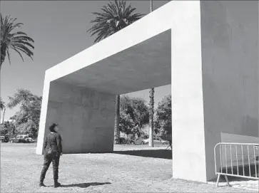  ?? Carolina A. Miranda Los Angeles Times ?? TERESA MARGOLLES looks up at her installati­on/memorial at Echo Park Lake, “La Sombra (The Shade).”