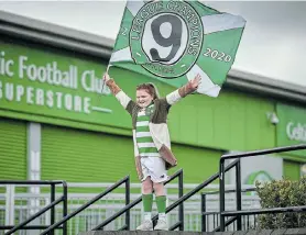  ?? Picture: JEFF J MITCHELL/GETTY IMAGES ?? A fan at Celtic Park celebrates his club for being crowned Scottish champions for the ninth season