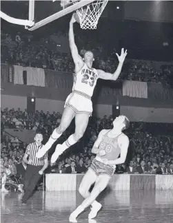  ?? | AP ?? Lou Hudson goes to the basket against Philadelph­ia’s Bill Melchionni in a game in St. Louis in 1967.