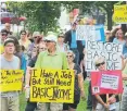  ??  ?? Protesters rallying at Victoria Park in Lindsay on Tuesday have taken issue with the provincial government’s decision to end the basic income project prematurel­y.