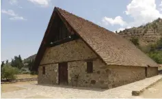  ??  ?? PANAGIA PODITHOU church in the village of Galata with its steep-sloping timber roof.