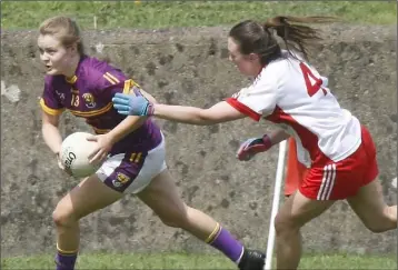  ??  ?? Wexford’s Chloe Foxe escaping the clutches of Christiane Hunter (Tyrone).