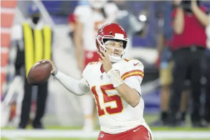  ??  ?? Kansas City Chiefs quarterbac­k Patrick Mahomes (15) in action during the first half of an NFL football game against the Baltimore Ravens, Monday, September 28, 2020, in Baltimore.