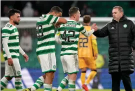  ?? ?? Ange Postecoglo­u with captain Callum McGregor at full time. The Celtic manager was not pleased with aspects of his side’s play