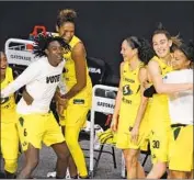  ?? CHRIS O’MEARA Associated Press ?? THE SEATTLE STORM are ecstatic after routing the Las Vegas Aces to win the WNBA title.