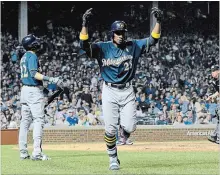  ?? ASSOCIATED PRESS FILE PHOTO ?? Milwaukee Brewers' Curtis Granderson celebrates after a home run. The ex-Toronto Blue Jay has moved around a lot, but offers experience.