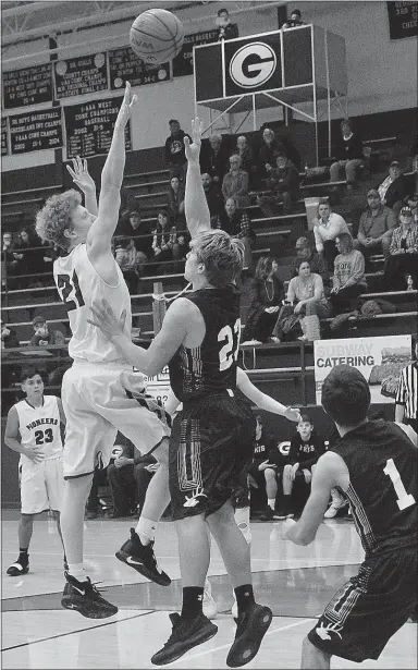  ?? Westside Eagle Observer/RANDY MOLL ?? Gentry’s Casey Bates shoots over the reach of an Elkins defender during play against Elkins at Gentry High School on Monday, Dec. 3.