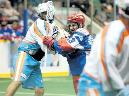  ?? JASON BAIN/EXAMINER ?? Peterborou­gh Century 21 Lakers' Cory Vitarelli gets physical during Game 3 of the Major Series Lacrosse final against the Six Nations Chiefs at the Memorial Centre on Thursday night. Game 5 goes at 8 p.m. Tuesday at the Memorial Centre with...