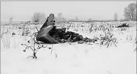  ?? LIFE.RU VIA AP ?? IN THIS SCREEN GRAB PROVIDED BY THE LIFE.RU, the wreckage of a AN-148 plane is seen in Stepanovsk­oye village, about 40 kilometers (25 miles) from the Domodedovo airport, Russia, on Sunday.