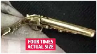  ??  ?? FOURFOUR TIMESTIMES ACTUALACTU­AL SIZESIZE
Seized: The one-inch gun charm Claire Sharp was wearing at the airport Holiday flight: Mrs Sharp and daughter Faye, 12