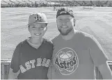  ?? Courtesy photo ?? Mickelson and his son Kepler, 11, were among the few Astros fans to watch Game 2 of the World Series at Dodger Stadium.