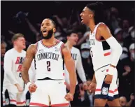  ?? Frank Franklin II / Associated Press ?? UConn’s R.J. Cole (2) and Isaiah Whaley celebrate during the second half against Seton Hall on Thursday.