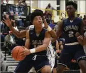  ?? ERIC BONZAR — THE MORNING JOURNAL ?? Lorain forward Levell Hall (10) is fouled by Cleveland Heights’ Andre Cash Jr. as he goes up for a shot.