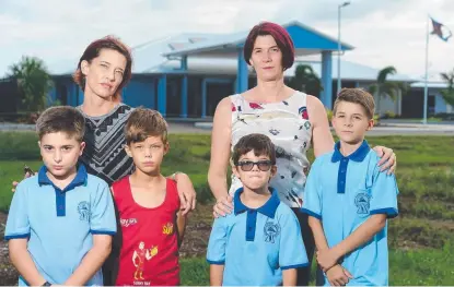  ?? UNEASY: Sandra Lyons with ( from left) her neighbour's son Nicolas Crespin, 8, her children Steve Wessel, 8, and Matthias Wessel, 6, and Leisa Quagliata with son Jacobie Goodwin, 9, in front of the recovery centre. Picture: EVAN MORGAN ??