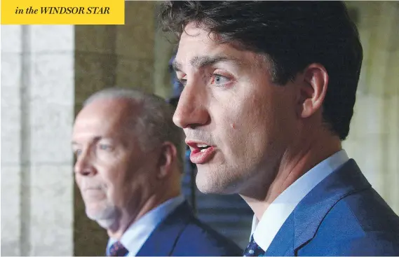  ?? SEAN KILPATRICK / THE CANADIAN PRESS ?? Prime Minister Justin Trudeau and B.C. Premier John Horgan meet the press Tuesday following their meeting, which touched on the wildfires and the opioid epidemic.