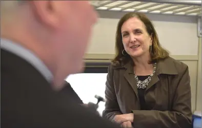  ?? H John Voorhees III / Hearst Connecticu­t Media ?? Metro-North Railroad President Catherine Rinaldi listens to Bethel First Selectman Matt Knickerboc­ker on the 9:05 a.m. train to South Norwalk on Thursday.