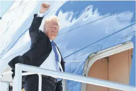  ?? Saul Loeb / Getty Images ?? President Donald Trump boards Air Force One at Canadian Forces Base Bagotville, bound for Singapore and a meeting with North Korean leader Kim Jong Un. The meeting will be the first between a sitting U.S. president and a North Korean leader.