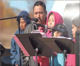  ??  ?? Parishoner­s gathered in the cold for the first ever mass held at St. Bernadette Catholic Church’s new site on Evergreen Road.