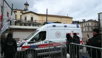  ?? — AFP photo ?? An ambulance leaves from Santa Maria church as Turkish anti riot police officers block the street after an attack in Istanbul.