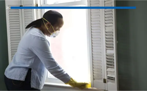  ?? Dawn Arlotta CDC photo ?? An African American woman preparing a window in her home for general cleaning. Visible minorities have suffered a disproport­ionate share of COVID-19 infections far beyond their percentage of the U.S. population.