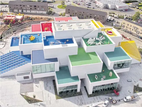  ?? LEGO A/S VIA THE NEW YORK TIMES ?? An undated handout photo shows the Lego House in Billund, Denmark. The latest Lego attraction offers a collection of creative zones for children and grown-ups — as well as the world’s first Lego restaurant.