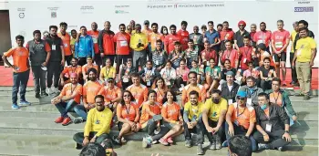  ?? ?? Winners of various events at the Airtel Hyderabad Marathon pose with their trophies alongside members of the organising team from Hyderabad Runners Society at the conclusion of the 10th edition in Hyderabad on Sunday.