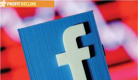  ?? — Reuters ?? A 3D-printed Facebook logo is seen in front of a displayed stock graph in this illustrati­on.