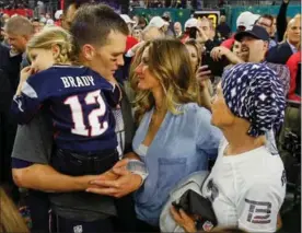  ?? KEVIN C. COX, GETTY IMAGES ?? Tom Brady celebrates with his wife, Gisele Bundchen, daughter Vivian Brady and his mother, Galynn, on Sunday after defeating Atlanta at NRG Stadium in Houston.