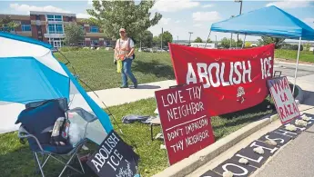  ?? Joe Amon, The Denver Post ?? The Rev. Anne Dunlap helps out with security for a weeklong action to show support for communitie­s and families affected by deportatio­n and separation at the U.S. Immigratio­n and Customs Enforcemen­t offices Monday in Centennial.