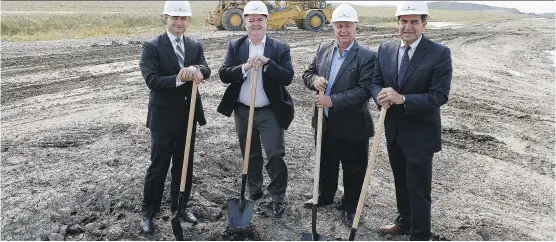  ?? FOR THE CALGARY HERALD ?? From left, Walton’s executive vice-president Craig Dickie, Walton CEO Bill Doherty, Ward 3 Calgary Coun. Jim Stevenson and John Plastiras, executive vice-president, real estate, for Walton Global Investment­s attended the recent ceremonial ground...