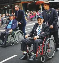  ?? Reuters ?? War veterans take part in an Anzac Day parade in Sydney, Australia, yesterday.