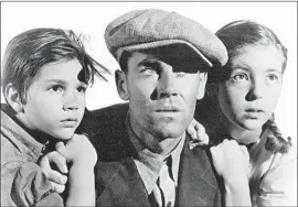  ?? 20th Century Fox ?? HENRY FONDA, center, in Ford’s 1940 Dust Bowl drama “The Grapes of Wrath.”