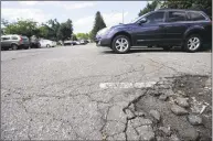  ?? Hearst Connecticu­t Media file photo ?? The Ridgefield Board of Selectmen voted Wednesday to award a project that will repair the pothole-ridden Bailey Avenue parking lot and expand the size of its spaces to meet required dimensions.