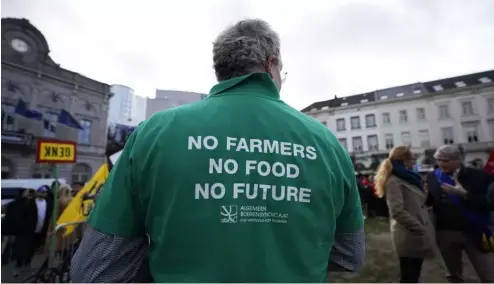  ?? ?? A farmer wears a shirt with a message during a demonstrat­ion of French and Belgian farmers outside the European Parliament in Brussels, on 24 January.