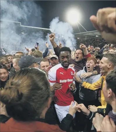  ?? PICTURE: MARTIN RICKETT/PA ?? MERRY MILLERS: Rotherham United’s Semi Ajayi celebrates on the pitch with home supporters after victory over Scunthorpe United in the League One play-offs at the AESSEAL New York Stadium. Rotherham will play Shrewsbury in the final at Wembley.