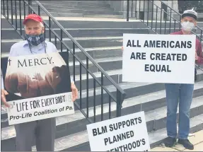  ?? CARL HESSLER JR. — MEDIANEWS GROUP ?? A group of about a dozen members of the Pro-Life Coalition of Pennsylvan­ia gathered at the Montgomery County Courthouse to show support for Commission­er Joseph C. Gale on June 18.