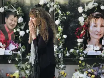  ?? Genaro Molina Los Angeles Times ?? ADELLE CASTRO, 68, of Temple City cries at a memorial for the 11 people killed in a mass shooting at a Lunar New Year celebratio­n at Star Ballroom Dance Studio in Monterey Park. “They were my family,” she said.